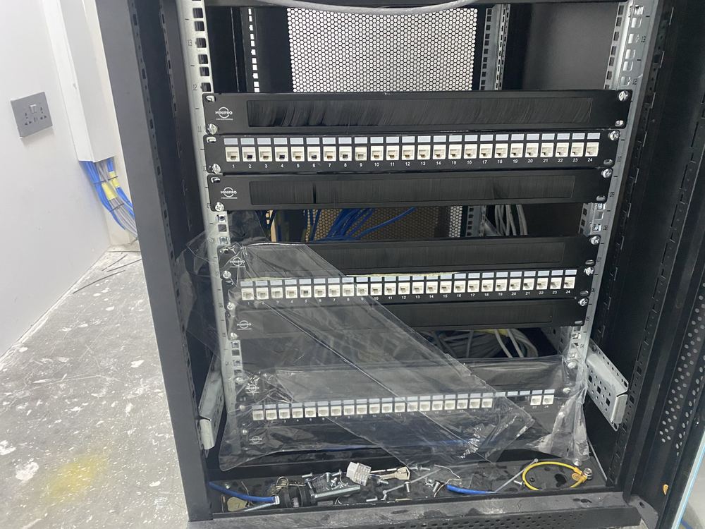 Completed patch panel rack with labeled ports